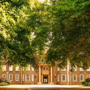 School entrance surrounded by trees